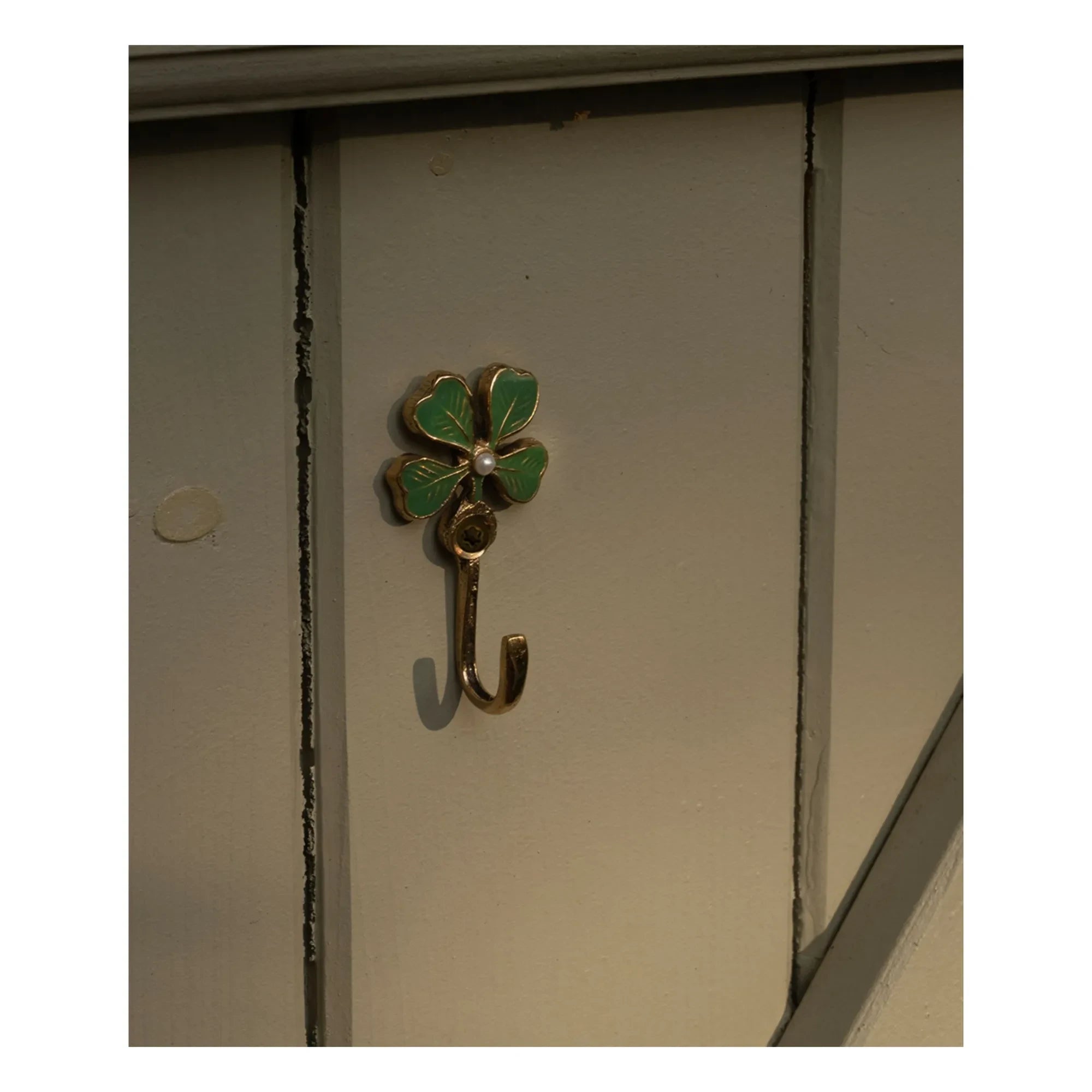 Doing Goods - Lucky Clover brass coat hanger | Gold